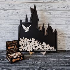 a black and white paper cut out of a castle