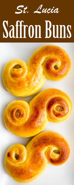 three saffron buns sitting on top of a white plate with the words, st lucia saffron buns