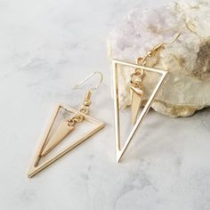 These long earrings are very stylish and perfect to wear with any outfit. They can be perfect for used in the day as well as at night with one of your favorite dresses. These rings are also a great idea as a gift for someone special! These triangle earrings are available with a gold or silver finish. Size:  Total Drop Length: 5.8 cm ( 2.28 inches ) Triangle Earrings Dangle, Book Locket Necklace, Double Triangle, Long Silver Earrings, Gold Triangle, Metalsmithing Jewelry, Sterling Silver Jewelry Handmade, Braided Leather Bracelet, Triangle Earrings