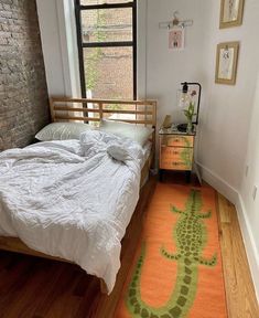 a bed sitting next to a window in a bedroom