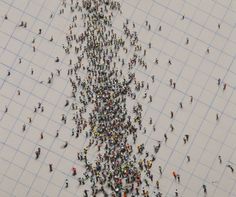 a large group of people standing in the middle of a graph paper