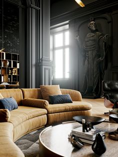 a living room filled with furniture next to a tall statue on the wall and windows