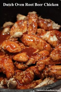 chicken wings covered in bbq sauce in a skillet with the words dutch oven rott