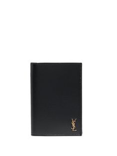 a black leather wallet with gold logo on the front and side, against a white background