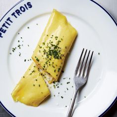 an omelet on a plate with a fork