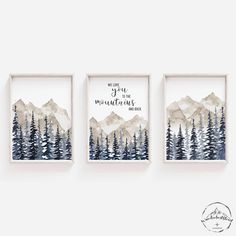 three watercolor paintings hanging on the wall in front of a white wall with trees and mountains