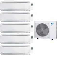 four air conditioners sitting next to each other in front of a white wall mounted heater