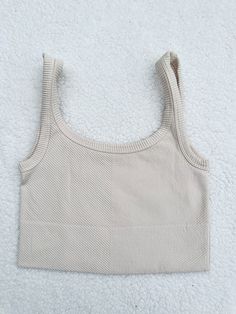 ☀Features: It is stretchy fits sizes XS-L ☀Details: Fabric: 92% Nylon / 8% Spandex Made in USA Seamless Cropped Beige Top, Fitted Seamless Crop Top, High Stretch Beige Ribbed Tops, Beige Seamless Crop Top, Ribbed Cropped Tank Top In Beige, Beige Ribbed Crop Top Tank, Stretch Beige Tank Crop Top, Beige Stretch Crop Tank Top, Chic High Stretch Beige Tops