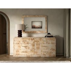 a large wooden dresser sitting next to a lamp