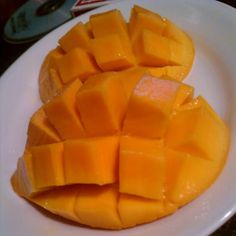 slices of melon and avocado on a white plate