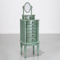 an old dresser with a mirror on top and drawers in the bottom drawer is painted green