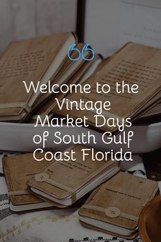 several books sitting on top of a table with the words welcome to the vintage market days of south gulf coast florida