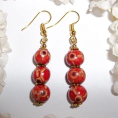 Red And Gold Wood Boho Earrings Jewelry Set Earring Earring Earring Earring 3807 Brand New And Handmade By Me - Wvluckygirl. They Have Wooden Beads That Are Red With Black And Yellow Designs On Them. They Also Have Gold Toned Costume Jewelry Beads Which Were Antiqued In Black. They Have French Fishhook Ear Wires For Her Pierced Ears. Measure 2 Inches Long And About 3/8 Inch Wide. Each Single Earring Only Weighs Approximately 1.2 Grams. Lightweight! Life Is Too Short To Wear Boring Earrings! You Red Jewelry For Pierced Ears As A Gift, Red Hypoallergenic Round Bead Earrings, Red Single Earring As Gift, Red Pierced Drop Earrings, Single Red Earring For Gift, Single Red Earring Gift, Red Dangle Earrings With Ear Wire, Red Hypoallergenic Dangle Earrings, Red Hypoallergenic Drop Earrings