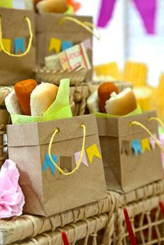 some paper bags with food in them sitting on a table