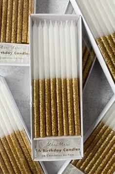 white and gold birthday candles in a box