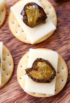 crackers with cheese and olives on them