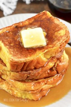 a stack of french toast with butter on top