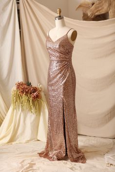 Elevate your evening look with this stunning sequin dress, perfect for bridesmaids or any special occasion. The Mora dress features a rose gold color that will add a touch of glam to your wardrobe. But wait, there's more - this dress can also be made in 10 different colors to suit your personal style! Color: Rose gold as shown, also can be made in 10 different colors.  Material: 100% Polyester Size: U.S Size 2-Size 26, Free Custom  Turn-Around Time: 30 days Sequin Dress Bridesmaid, Rose Gold Sequin Bridesmaid Dress, Gold Sequin Bridesmaid Dress, Rose Gold Prom Dress, Sequin Bridesmaid Dress, Rose Gold Dress, Sequin Bridesmaid, Sequin Bridesmaid Dresses, Rose Gold Sequin