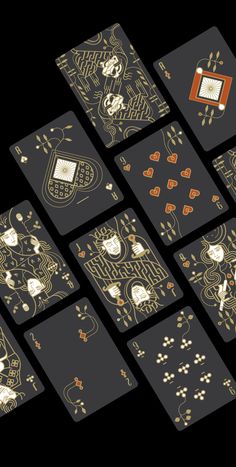 the playing cards are designed to look like they have gold foil on them and black background