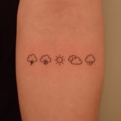 a woman's arm with the weather and clouds tattoo on her left side calf