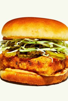 a chicken sandwich with lettuce and cheese