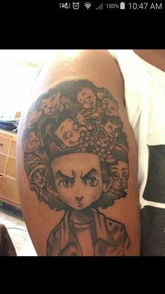 a man with a tattoo on his arm has an image of a woman's head