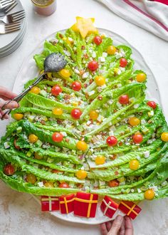 lettuce christmas tree with tomatoes and cheese on it