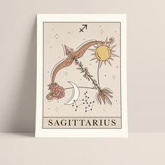 a tarot card with the zodiac sign sagittarius and flowers on it