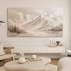 a living room filled with furniture and a large painting on the wall above it's coffee table