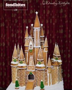 a gingerbread castle made to look like it is going to be built in the snow