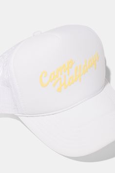 a white trucker hat with the words camp holiday printed on it's front