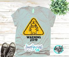 a t - shirt that says warning with an image of a dog on it