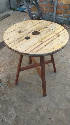 a wooden table with holes in the middle