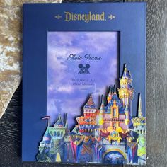 the disneyland castle photo frame is on display