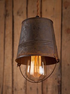 an old fashioned light hanging from the ceiling