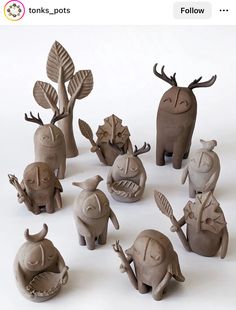 there are many clay animals in the shape of trees