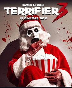 a man dressed as santa claus holding a popcorn bucket in front of the movie poster