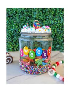 a glass jar filled with lots of candy