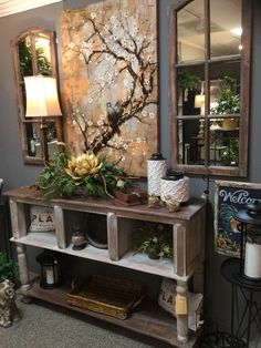 a room filled with lots of furniture and decor on top of carpeted flooring