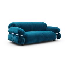 a blue couch sitting on top of a white floor