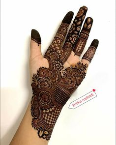 a hand that has some henna on it