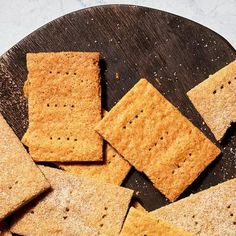 some crackers are on a wooden plate