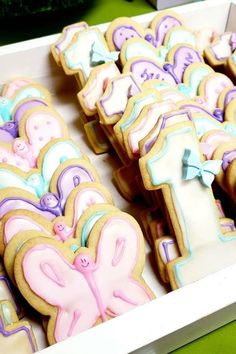 some decorated cookies in a box on a table