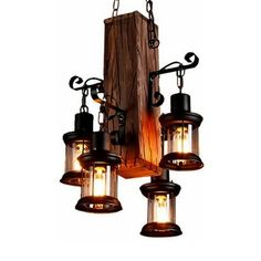 an old fashioned light fixture hanging from a wooden beam with five lights on each side