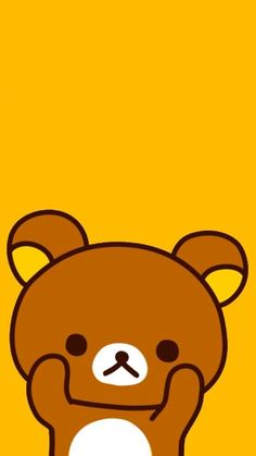 a brown teddy bear sitting on top of a yellow background