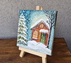 a small easel with a painting on it