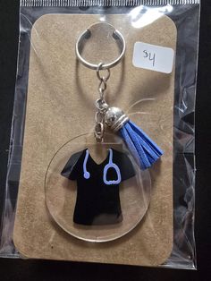 a keychain with a doctor's cap and stethoscope on it