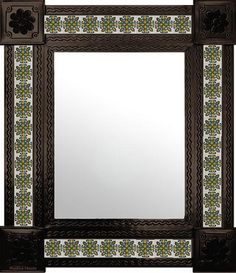 a decorative mirror with an ornate border around the edges and flowers painted on the sides