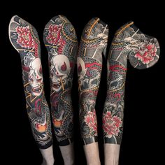 three leg sleeves with tattoos on them and one has a skull in the middle, while the other two are decorated with flowers