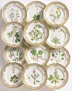 a bunch of plates that have flowers on them